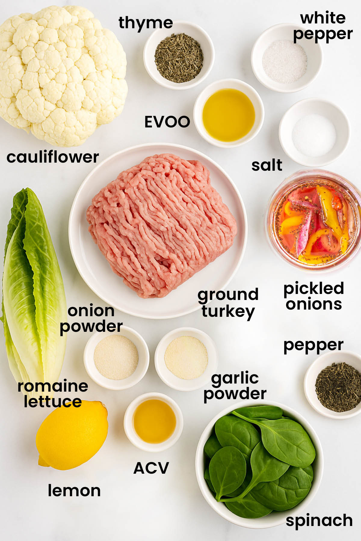 individual ingredients for roasted cauliflower turkey salad laid out against a white background.