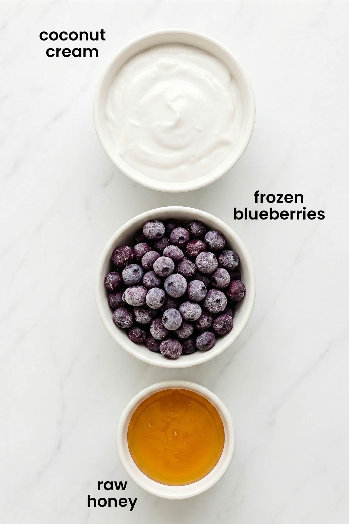 individual ingredients for homemade blueberry pup cups laid out against a white background.