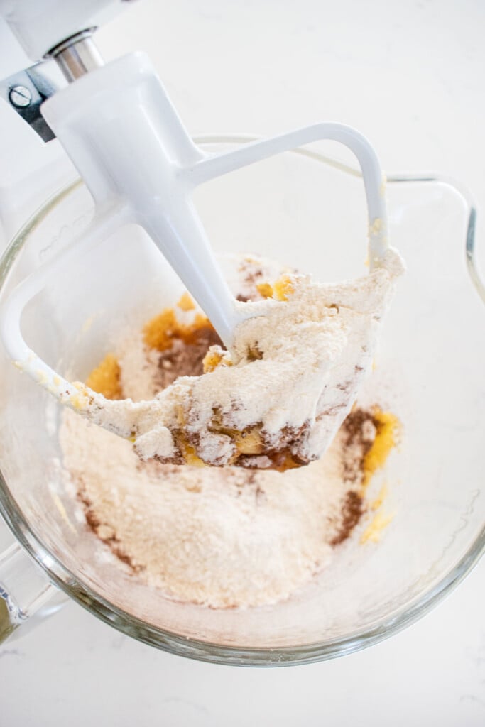 ingredients for chocolate espresso biscotti cookie dough in a glass mixing bowl.