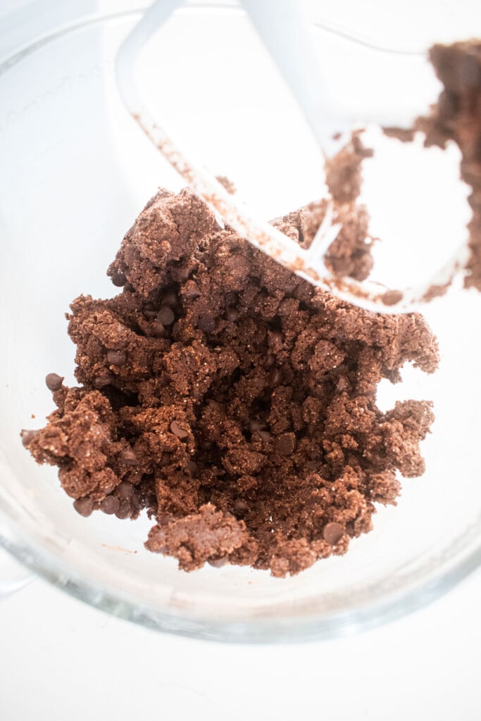 chocolate espresso biscotti cookie dough in a glass mixing bowl.