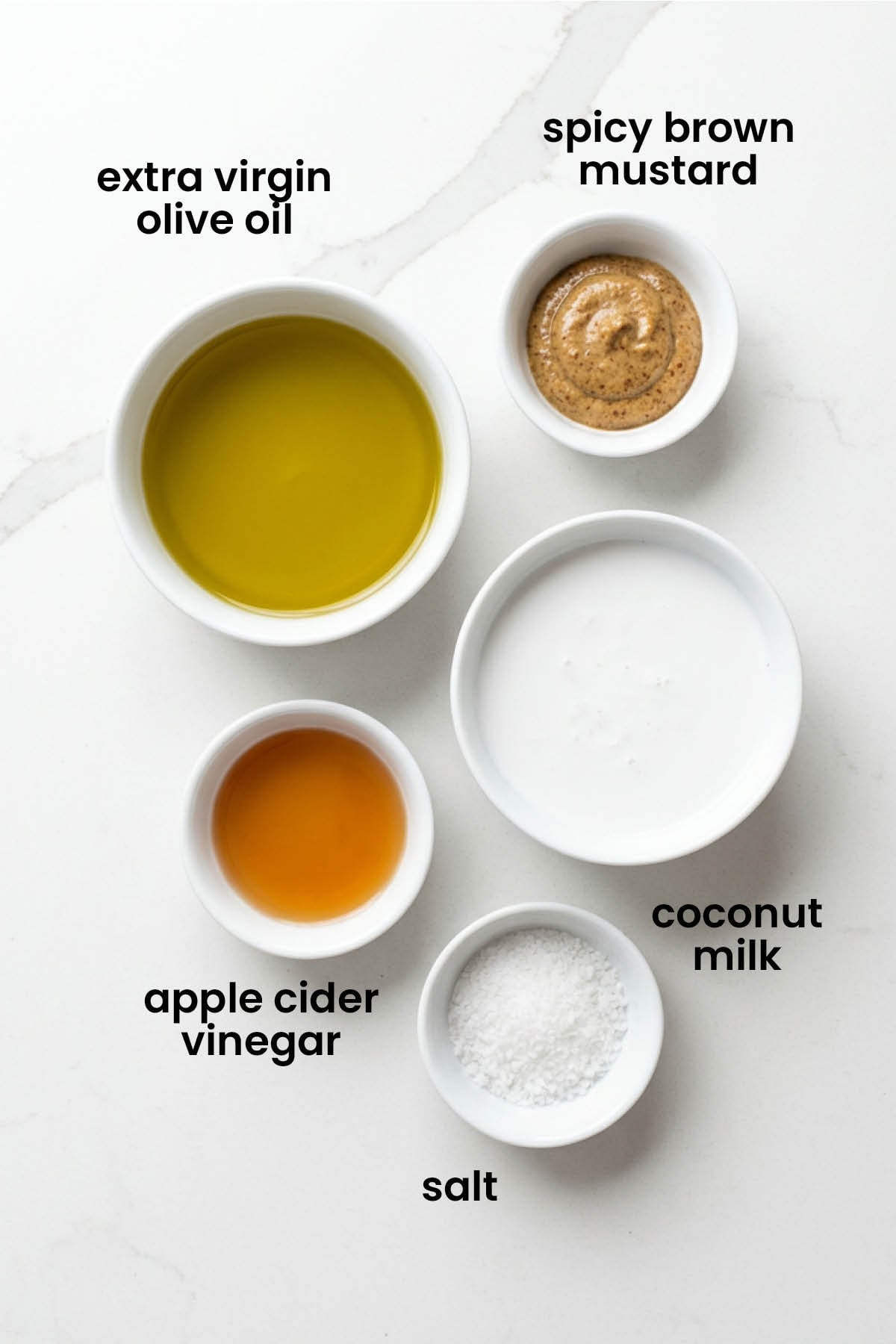 individual ingredients for vegan honey mustard dressing laid out against a white background.