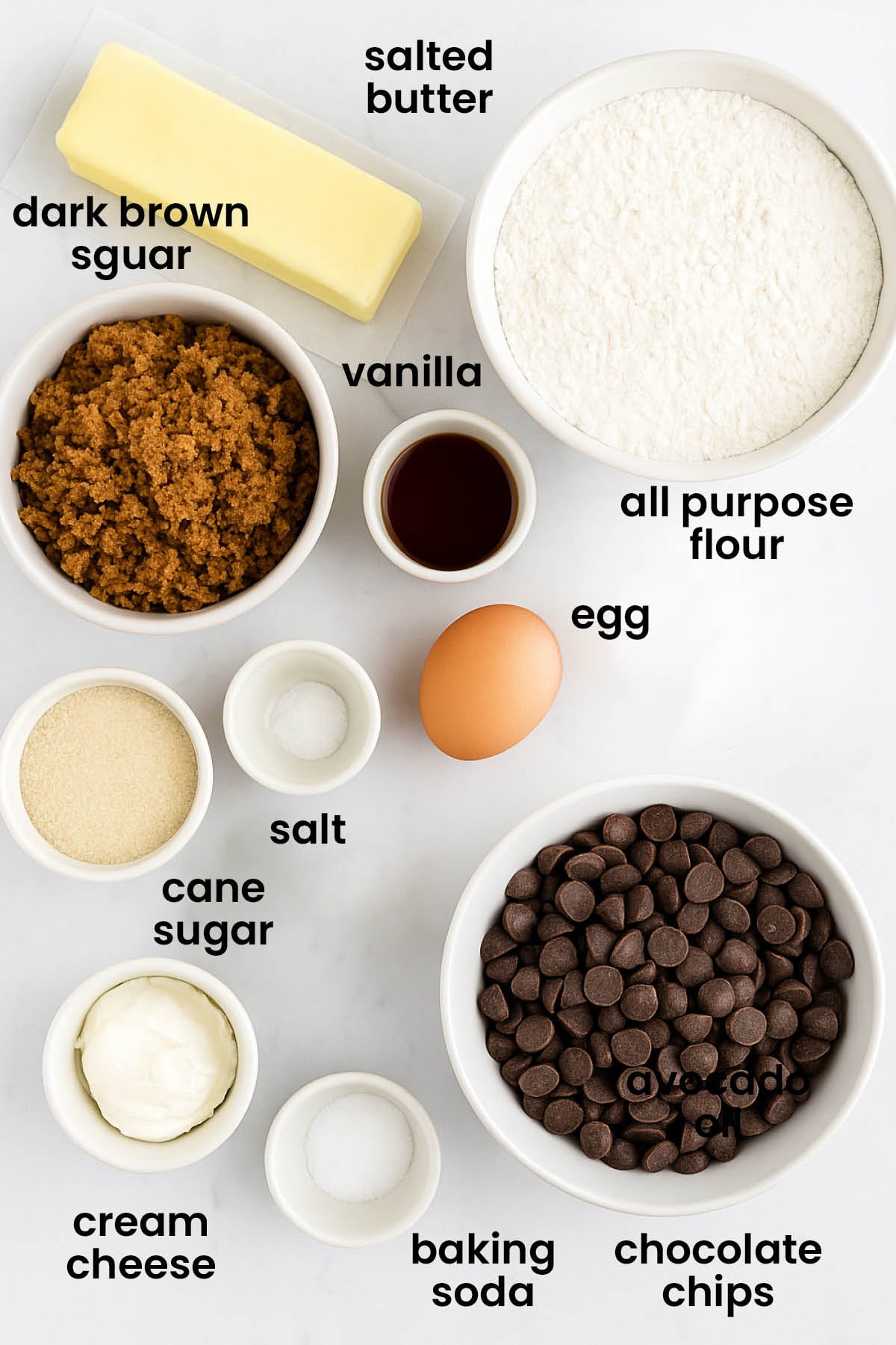 individual ingredients for cream cheese chocolate chip cookies laid out against a white background.