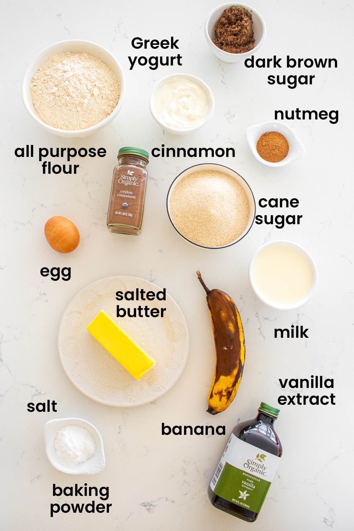 individual ingredients for snickerdoodle banana baked donuts laid out against a white background.