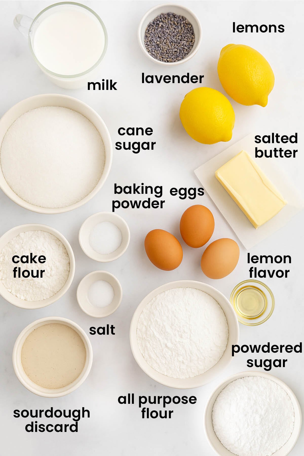individual ingredients for sourdough lavender lemon bundt cake laid out against a white background.