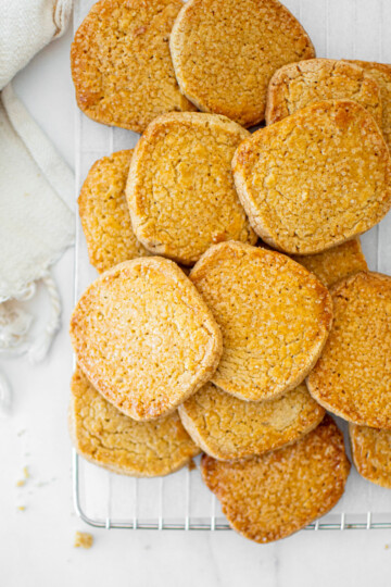 kamut flour shortbread cookies on a cooling rack on a marble table.