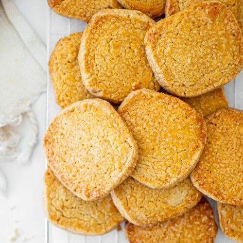 kamut flour shortbread cookies on a cooling rack on a marble table.