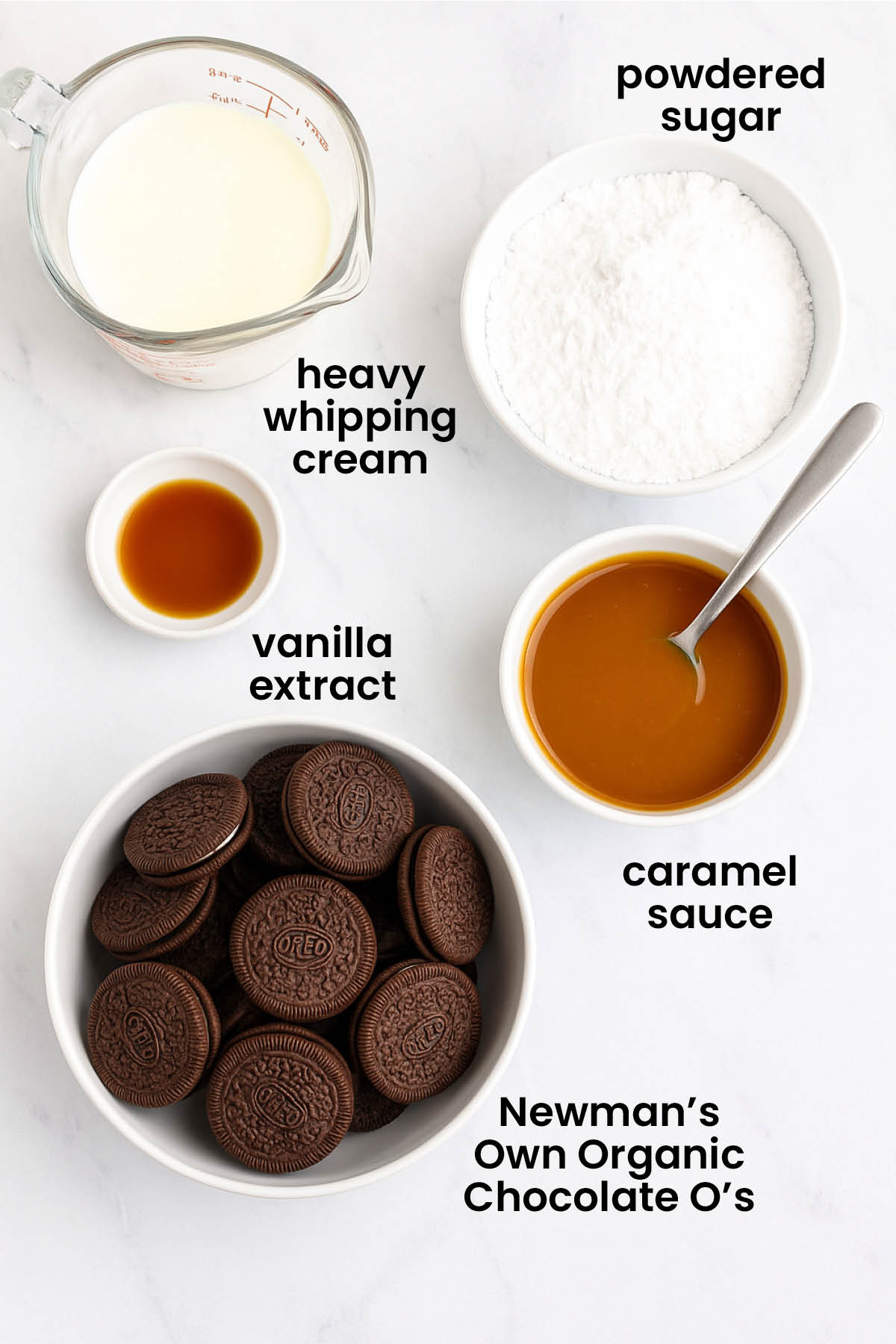 individual ingredients for caramel chocolate oreo icebox cake laid out against a white background.
