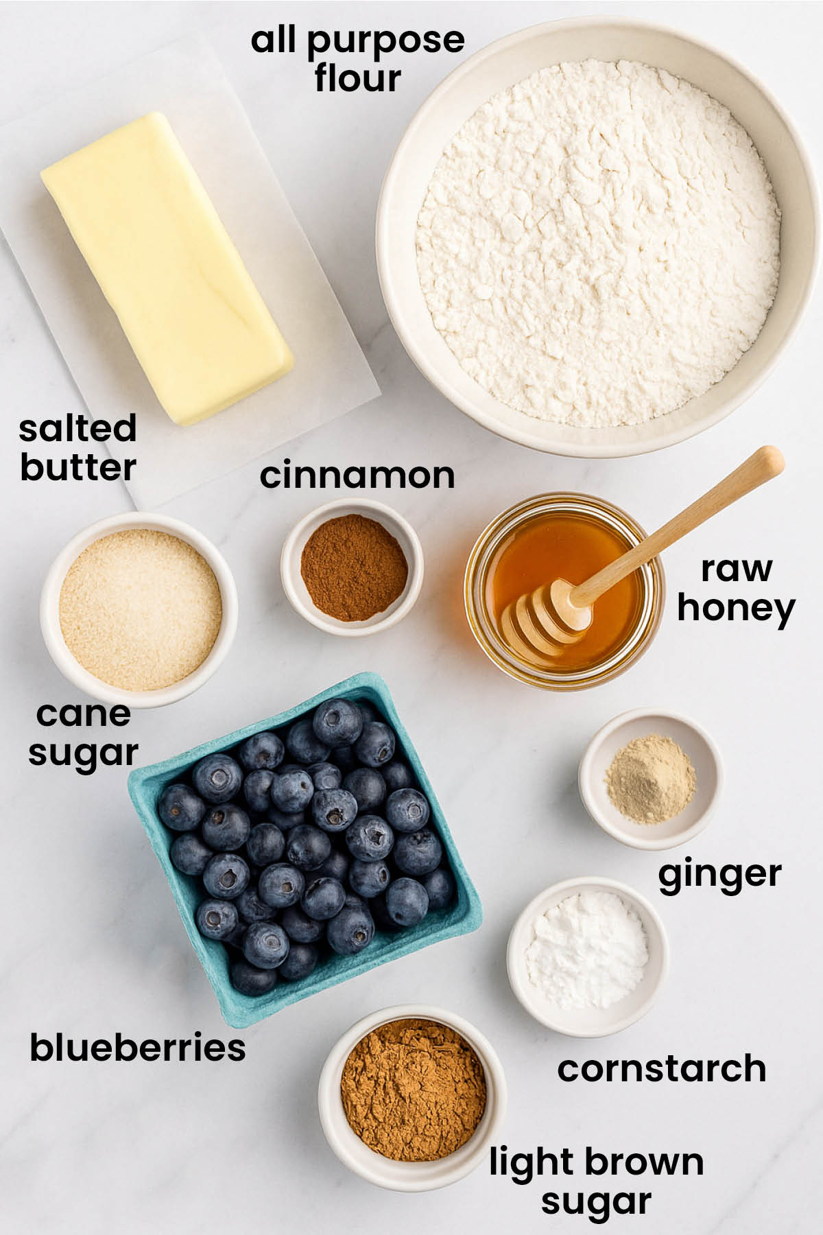 individual ingredients for blueberry honey crumble pie laid out against a white background.