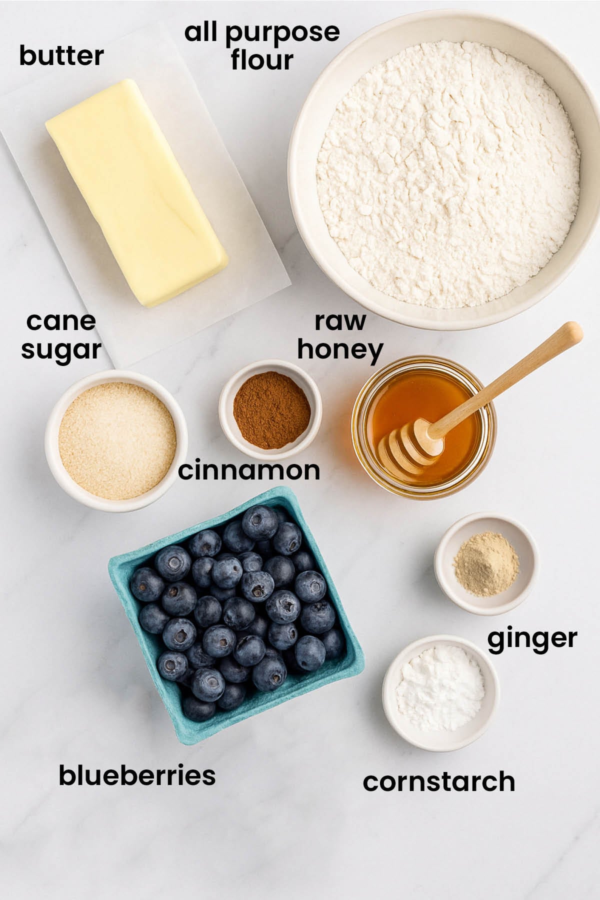individual ingredients for blueberry honey crumble pie laid out against a white background.