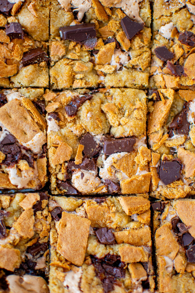 chocolate caramel smore bars cut into squares.
