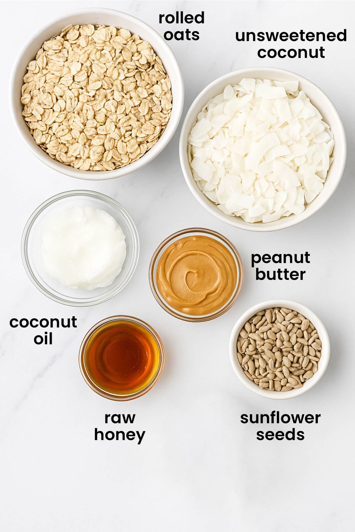 individual ingredients for peanut butter honey granola for dogs laid out against a white background.