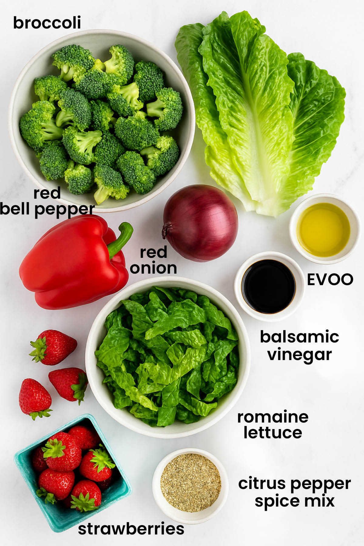 individual ingredients for strawberry balsamic broccoli salad laid out against a white background.