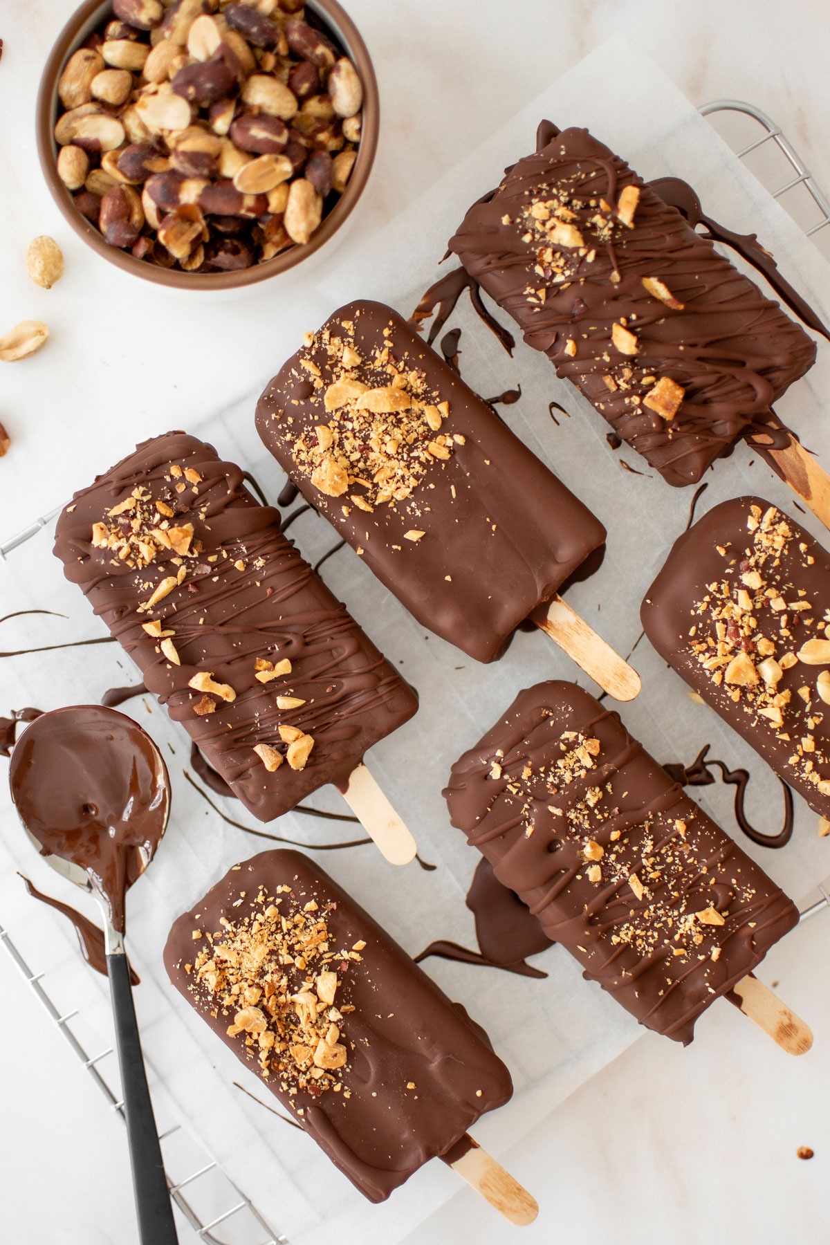 vegan chocolate peanut butter ice cream bars on parchment paper.