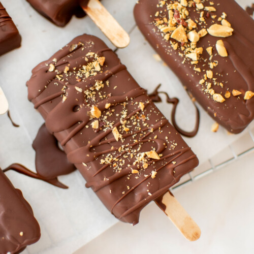 vegan chocolate peanut butter ice cream bars on parchment paper.