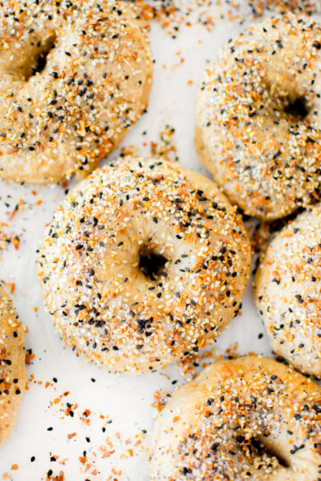 bone broth everything bagels on white parchment paper.