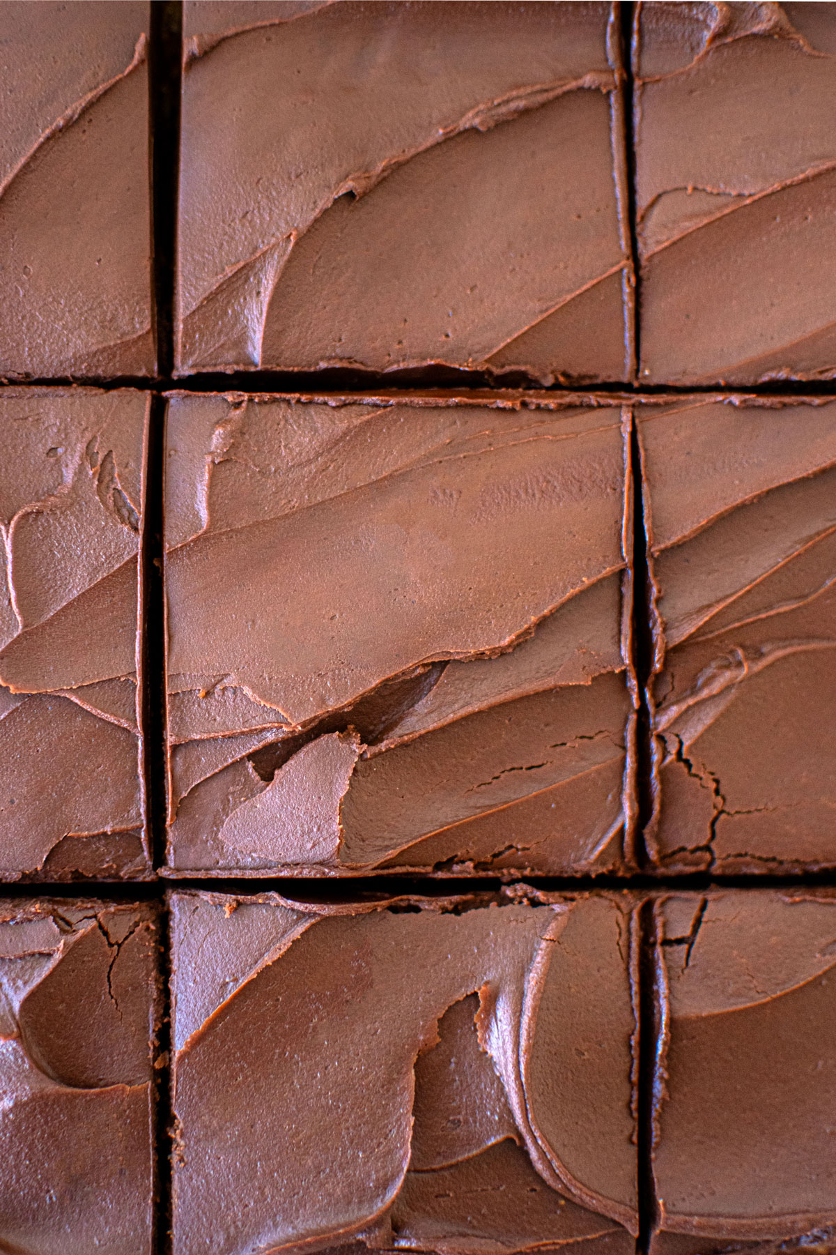 chocolate peanut butter banana cake cut into square slices.