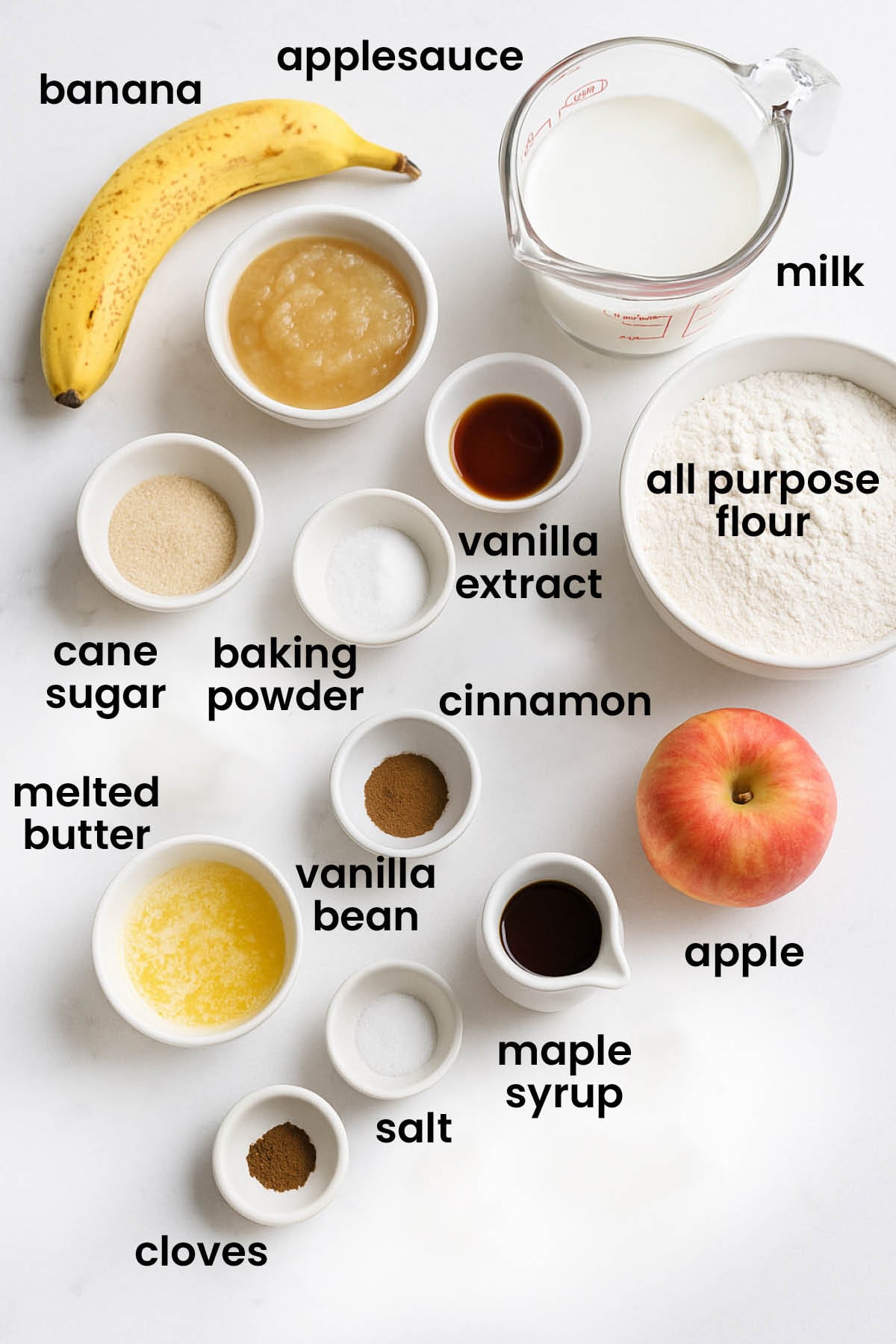 individual ingredients for eggless apple cinnamon waffles laid out against a white background.