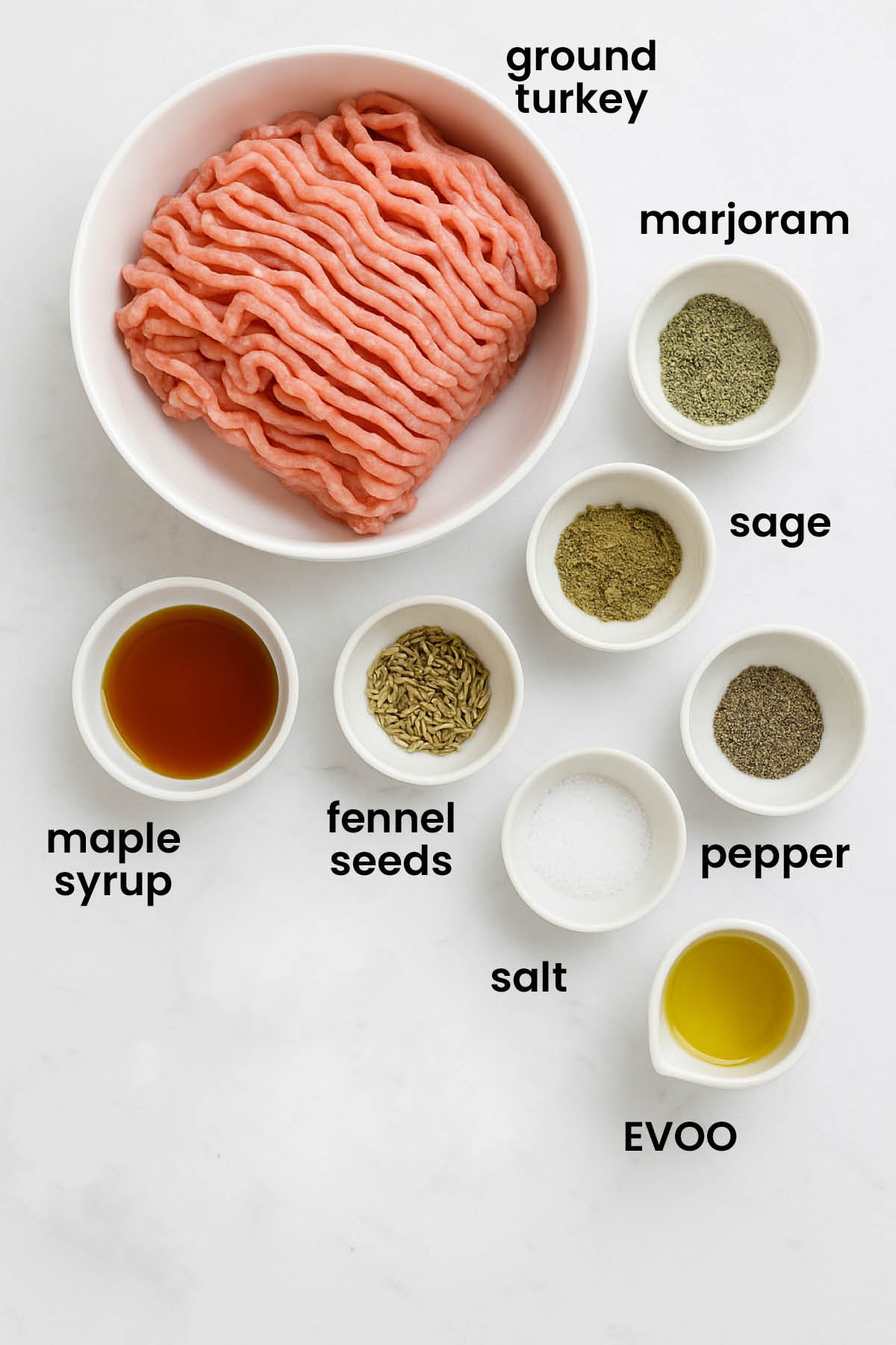 individual ingredients for maple turkey breakfast sausages laid out against a white background.