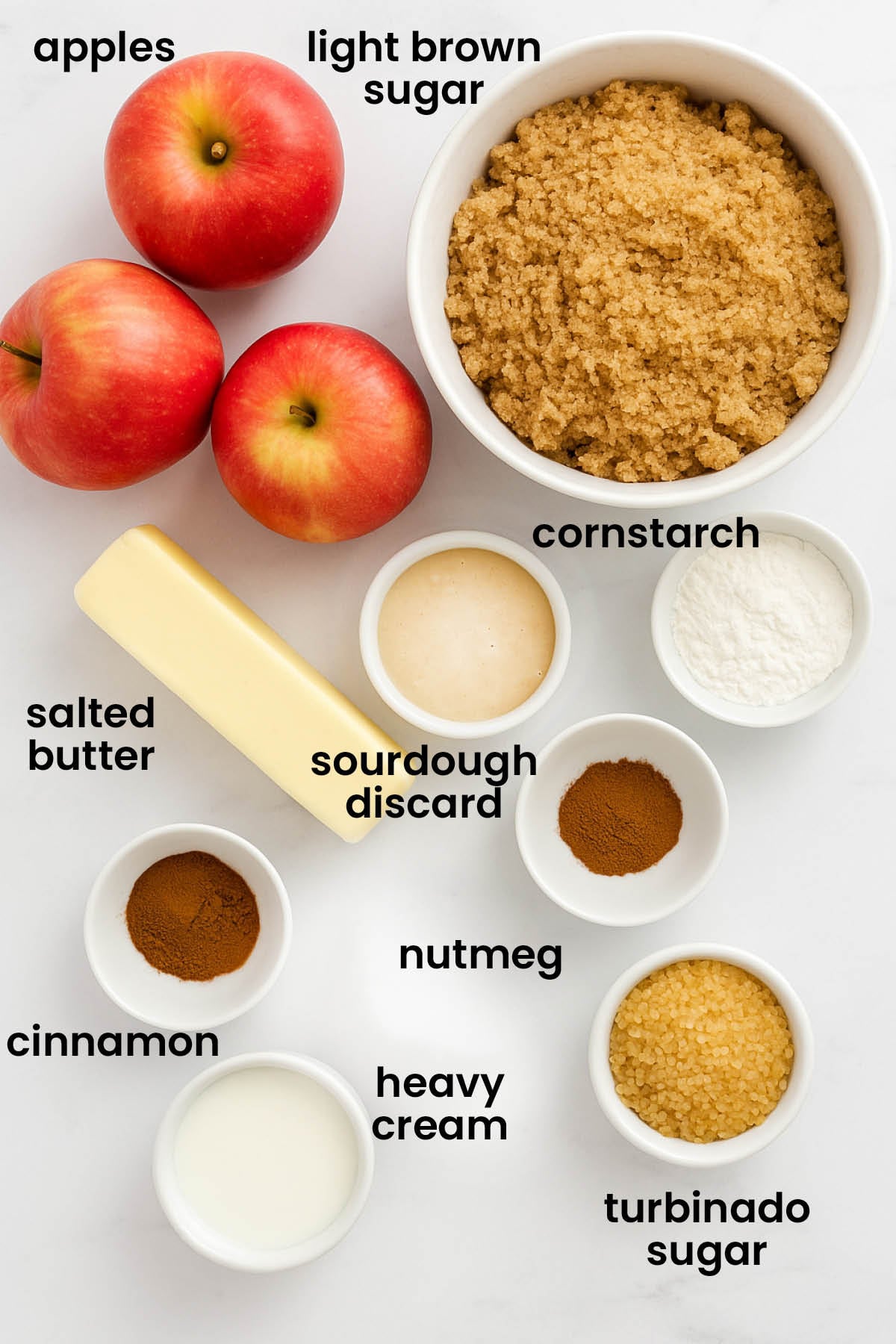 individual ingredients for sourdough apple pie laid out against a white background.