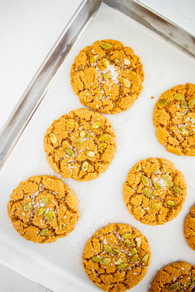 vegan pumpkin spice almond butter cookies on a baking sheet.