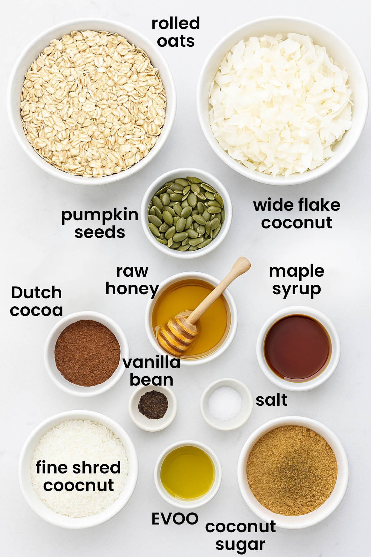 individual ingredients for chocolate olive oil granola laid out against a white background.