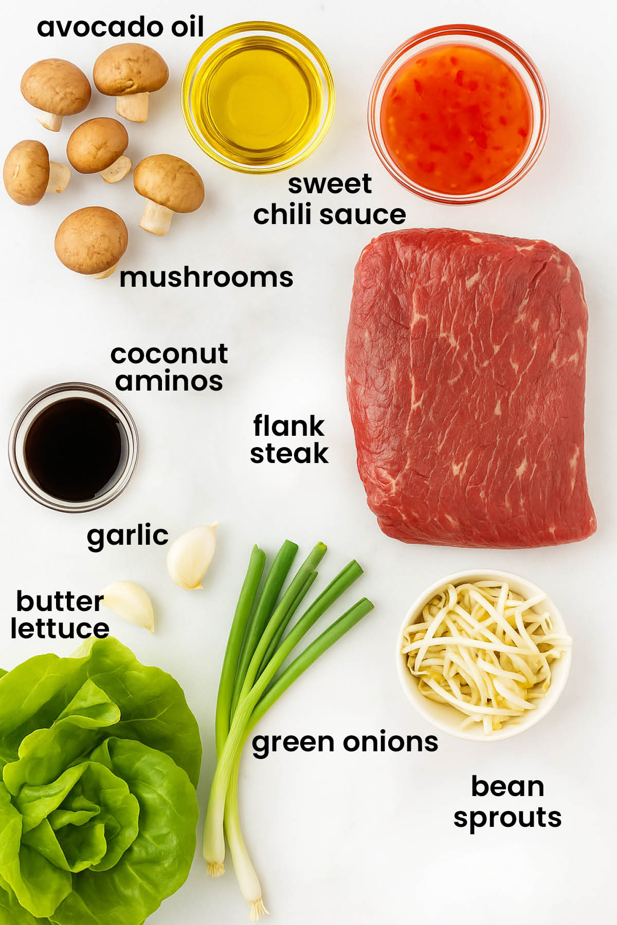 individual ingredients for flank steak asian lettuce wraps laid out against a white background.