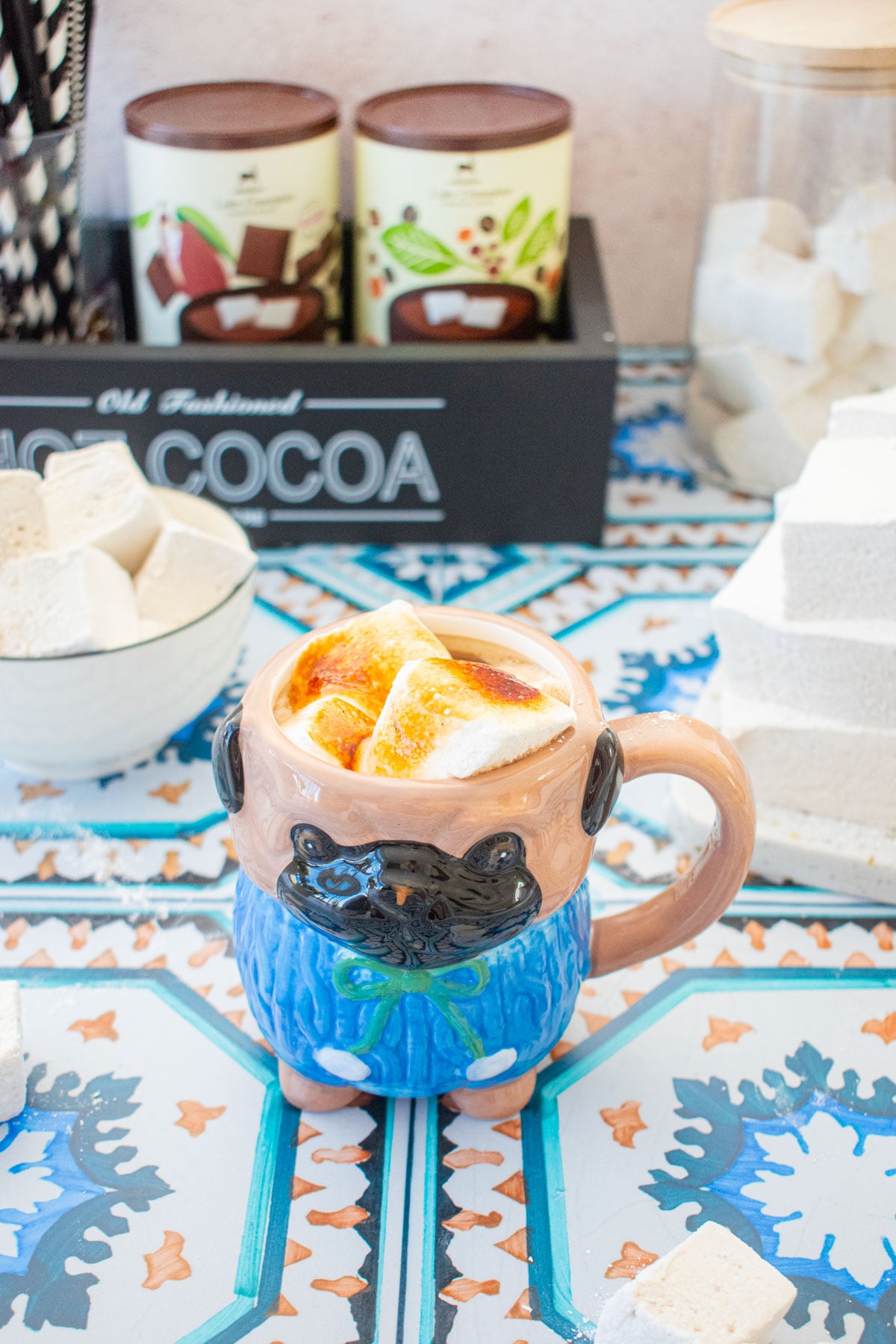 pug shaped mug with hot cocoa and mini marshmallows on top that have been torched to perfection.