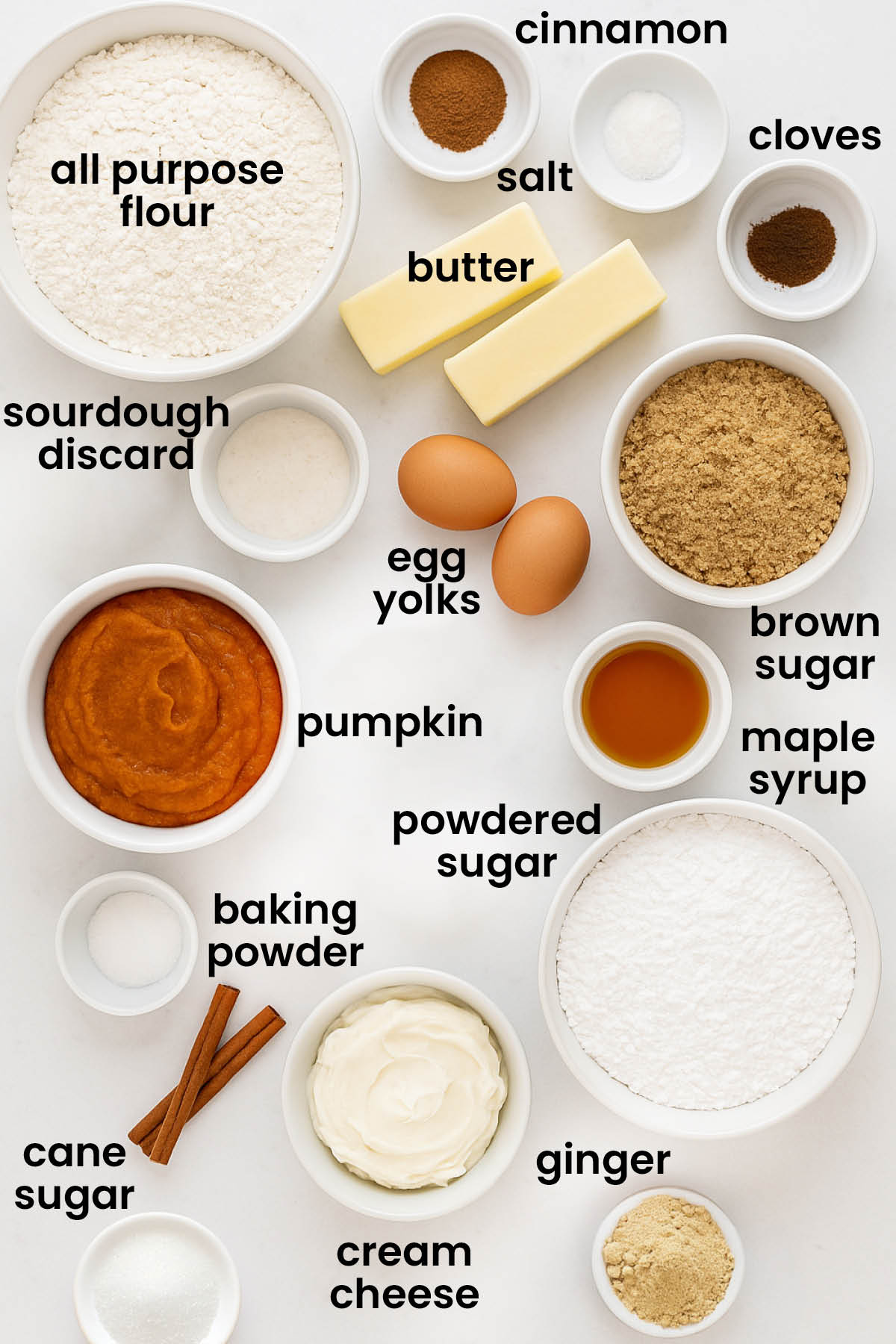 individual ingredients for sourdough pumpkin spice cupcakes laid out against a white background.