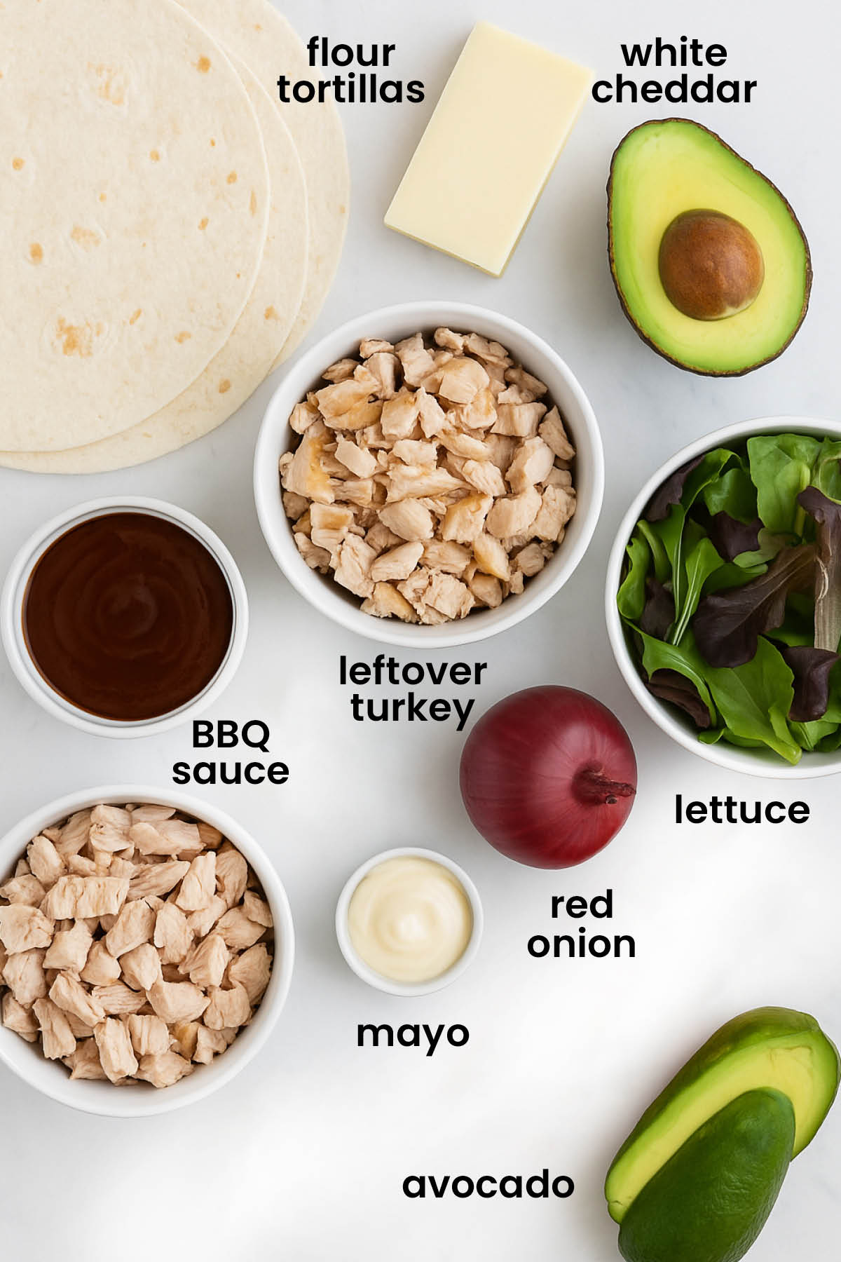 individual ingredients for BBQ turkey avocado wrap laid out against a white background.