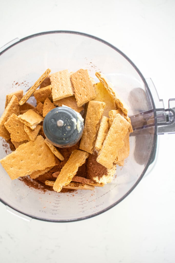 graham crackers, cane sugar, butter, and dutch cocoa powder in a food processor.