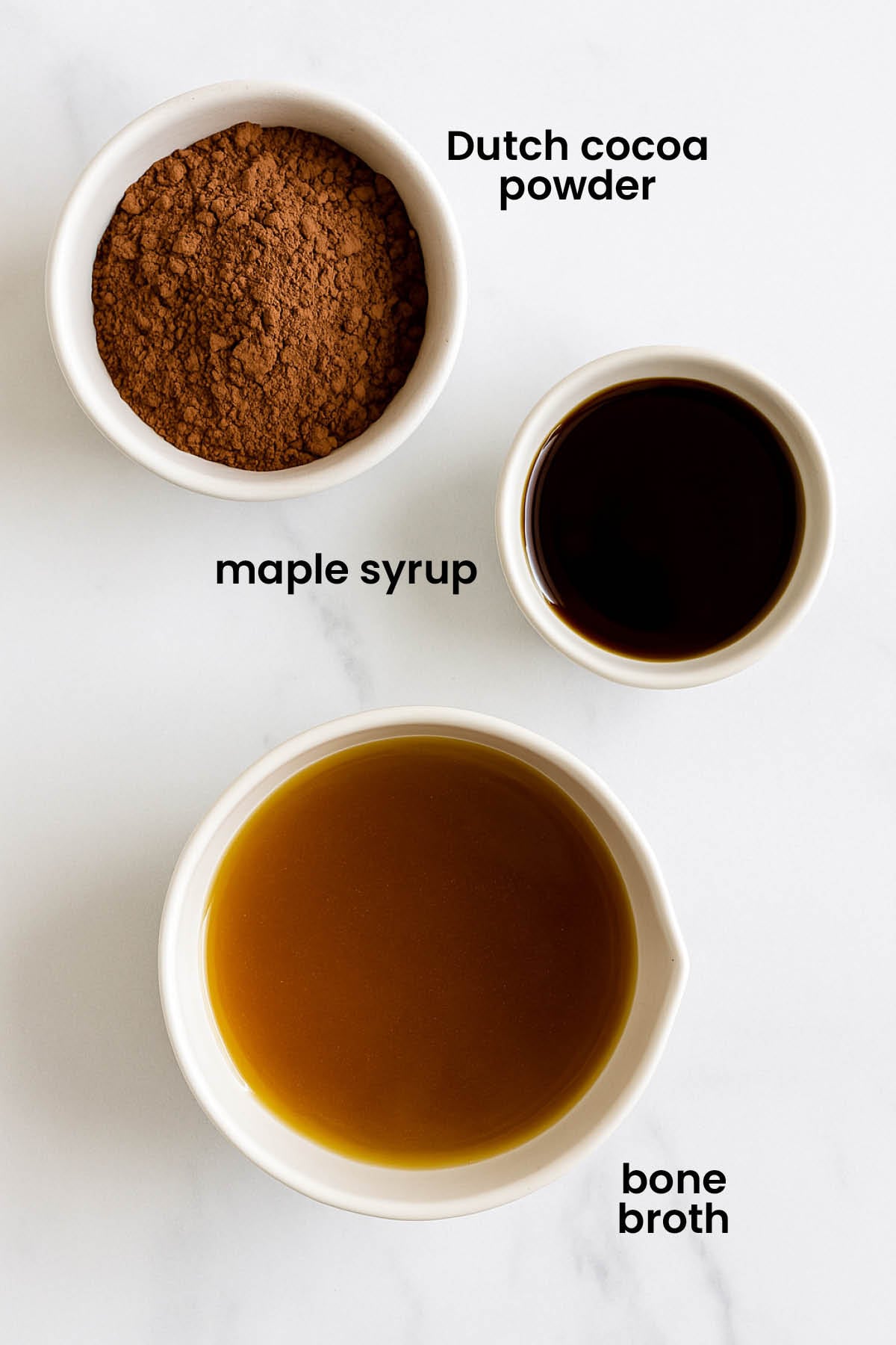 individual ingredients for bone broth hot cocoa laid out against a white background.