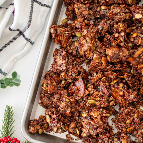 baking sheet of chocolate peppermint olive oil granola on a white marble counter.