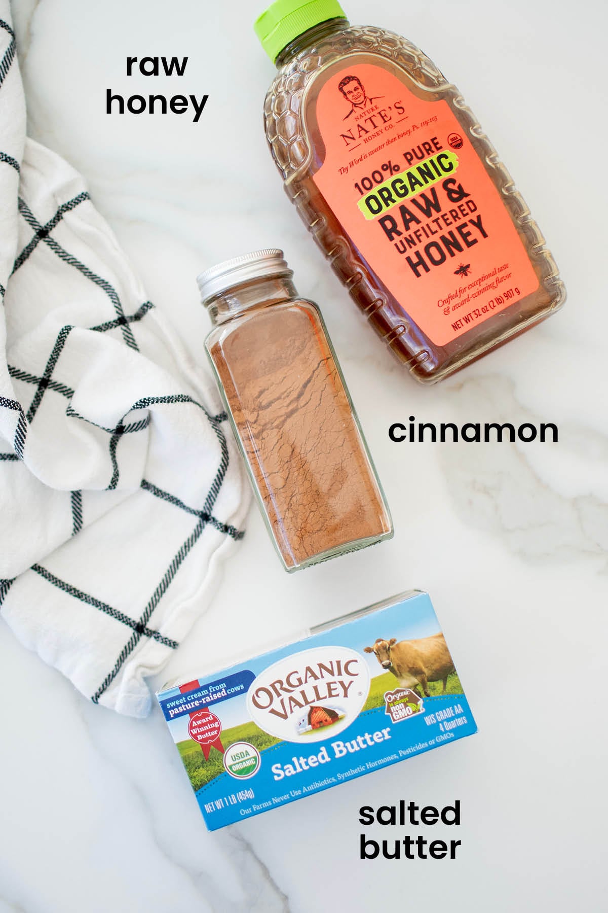 individual ingredients for cinnamon honey butter spread laid out against a white background.