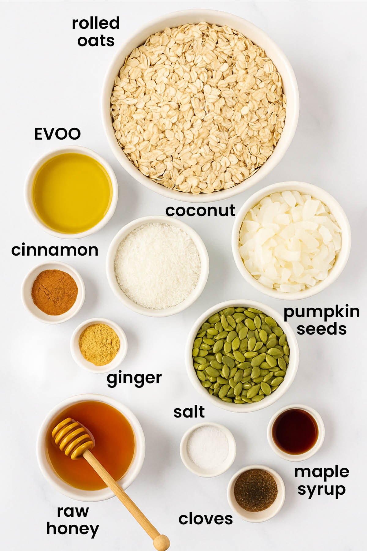 individual ingredients for healthy gingerbread granola laid out against a white background.