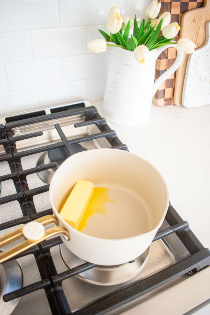 butter melting in a small pot on the stovetop.
