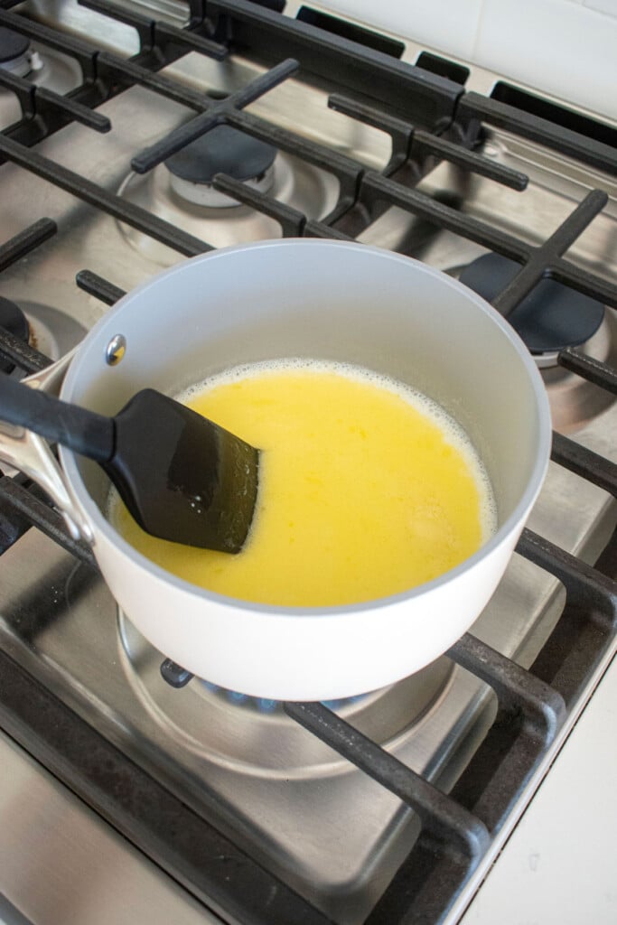 melted eggnog and butter in a small pot on the stove.