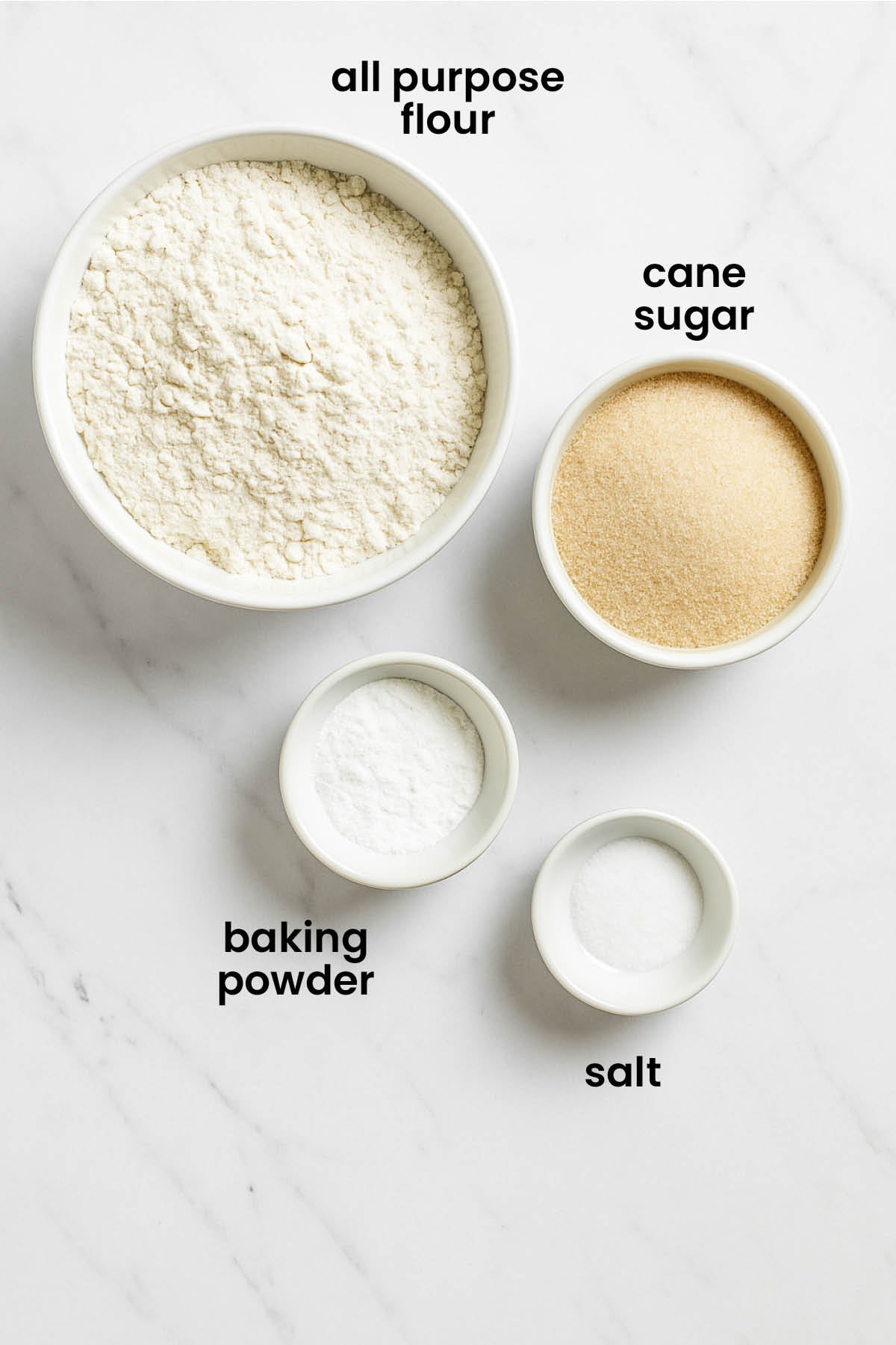 individual ingredients for sugar cookie mix for gifts laid out against a white background.