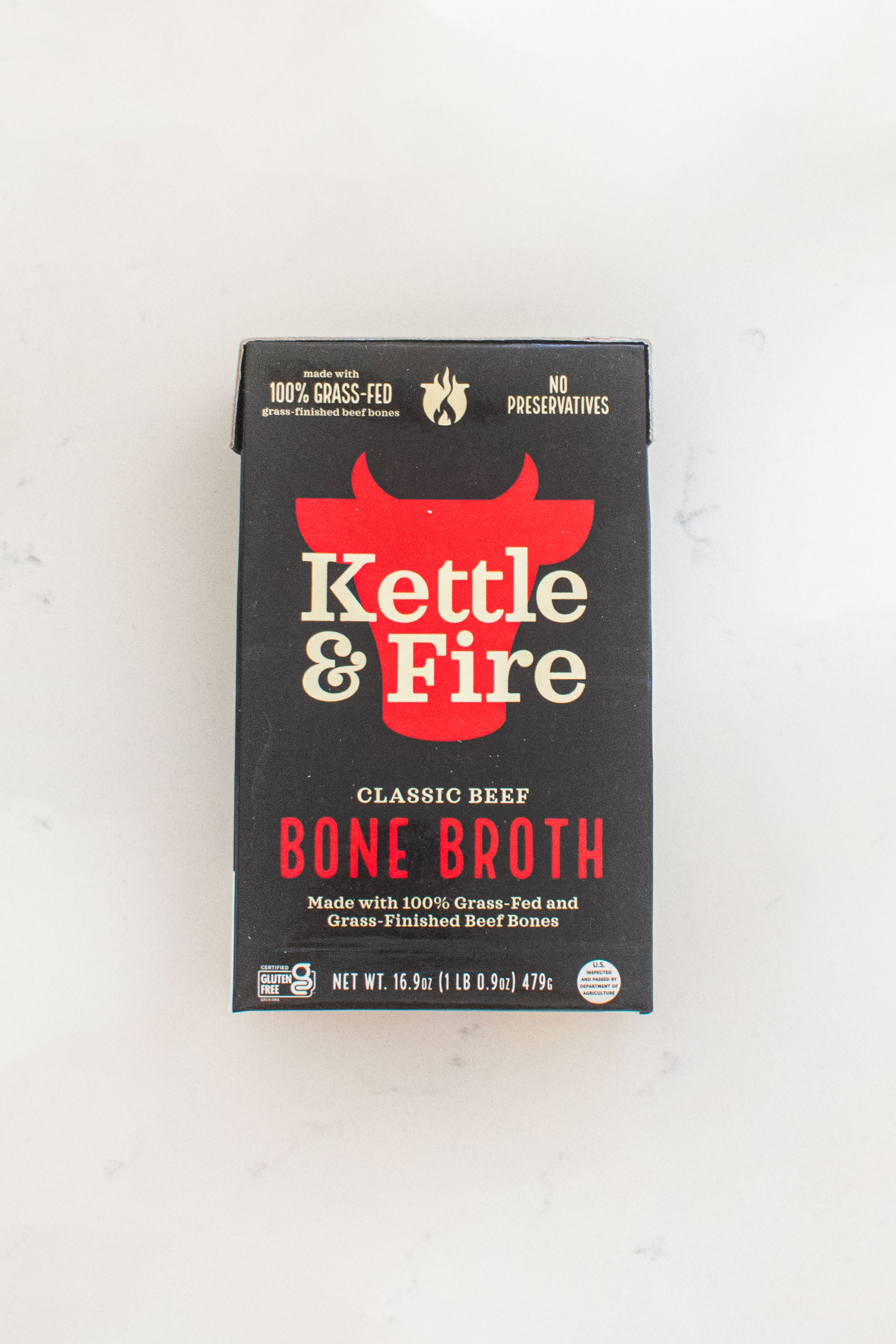 kettle and fire beef bone broth on a white countertop.