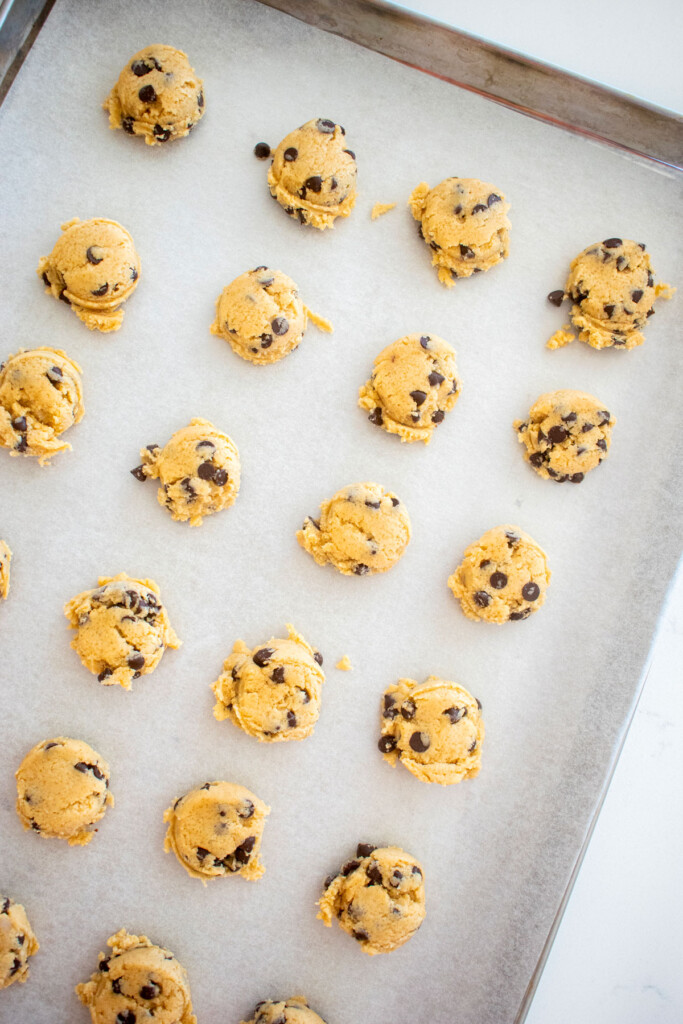baking sheet with mini chocolate chip cookie dough scooped.