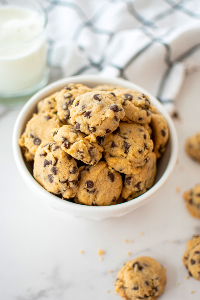 bowl of brown sugar chocolate chip mini cookies on a marble counter.