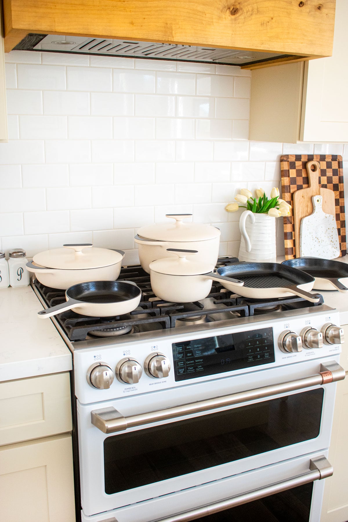 caraway enameled cast iron cookware set on a stovetop.