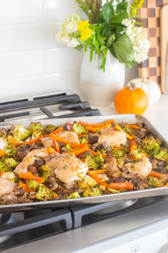 honey garlic chicken sheet pan dinner sitting on a stovetop.