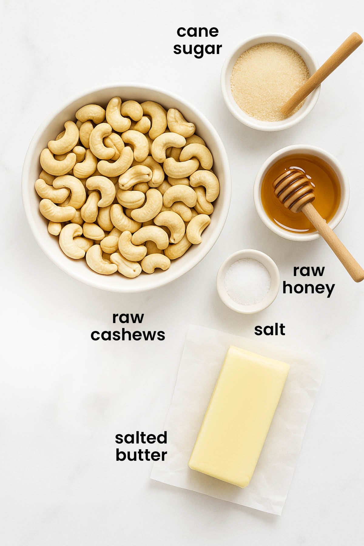 individual ingredients for honey roasted cashews laid out against a white background.