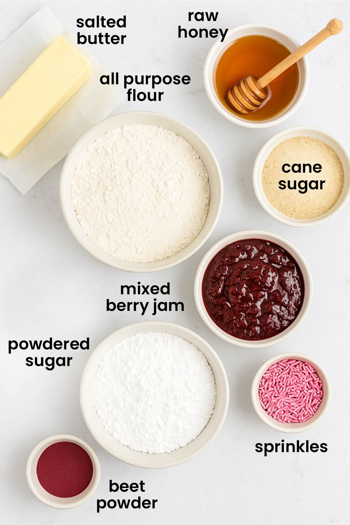 individual ingredients for mixed berry hand pies with glaze laid out against a white background.