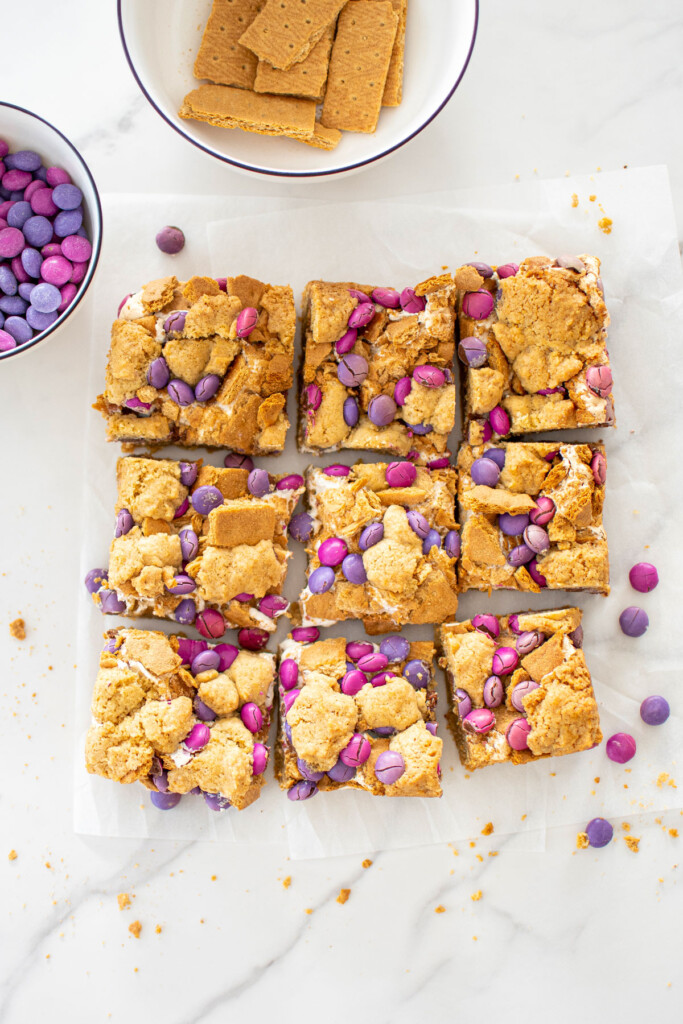 valentine's day smore bars cut into 9 square bars on a white marble counter.