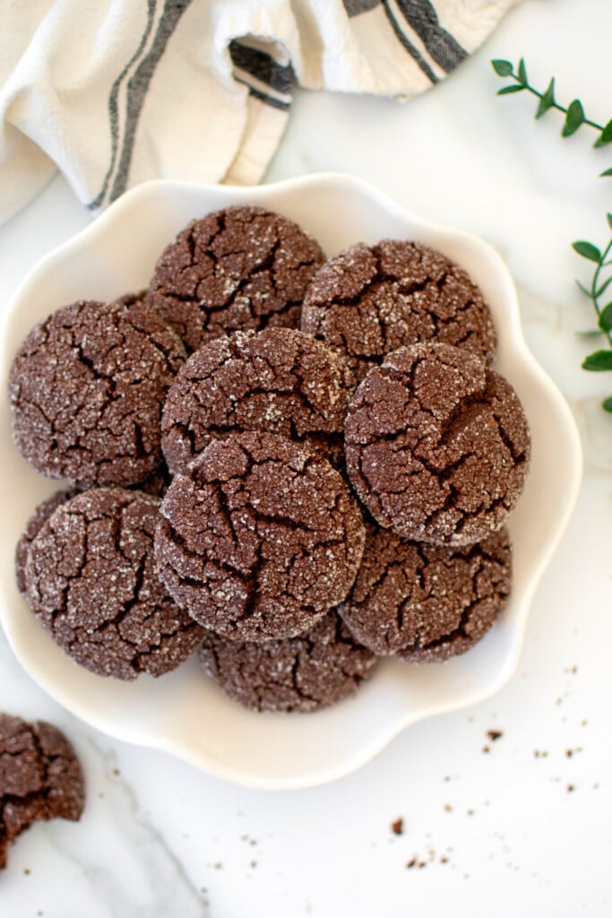 plate of vegan gluten free chocolate peanut butter cookies on a white marble counter.
