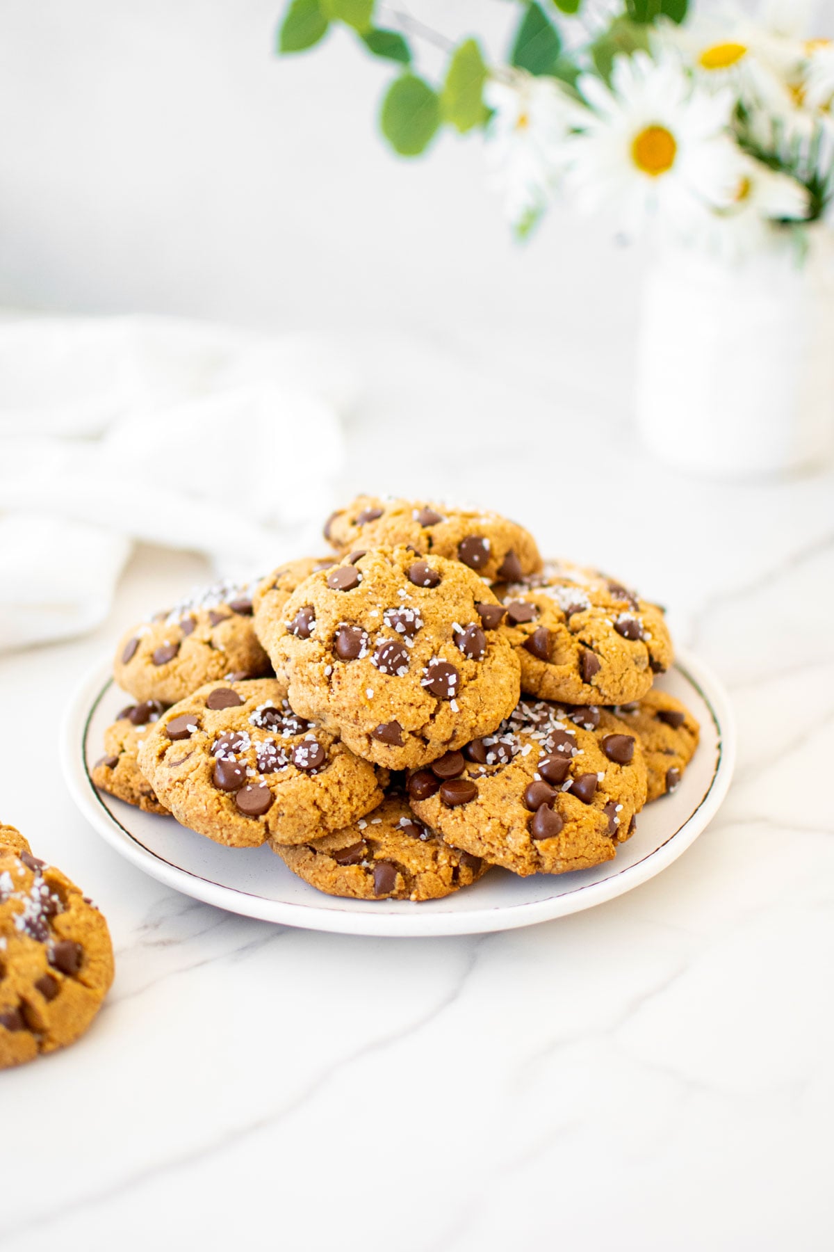 plate of healthy chocolate chip cookies with coconut sugar on a marble counter.