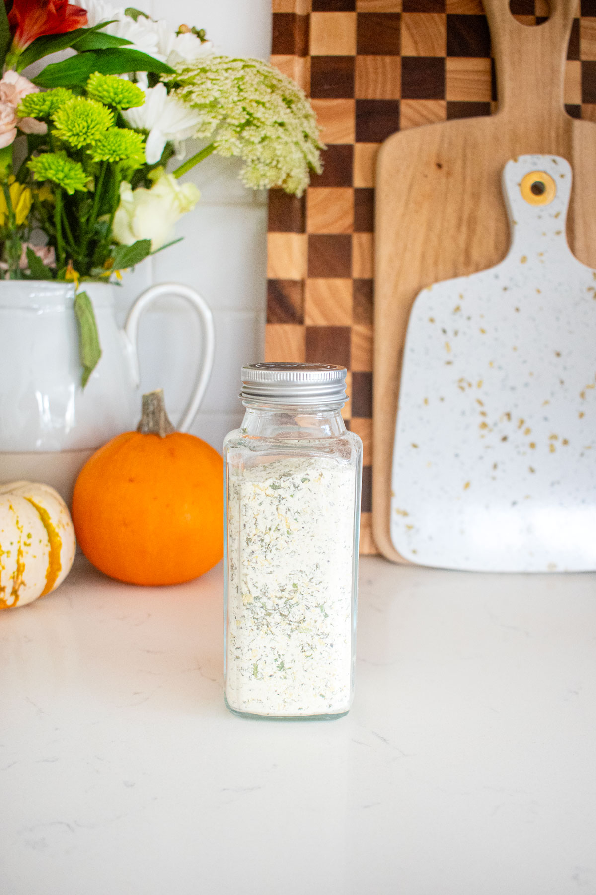 homemade ranch reasoning mix in a spice jar on a kitchen counter.