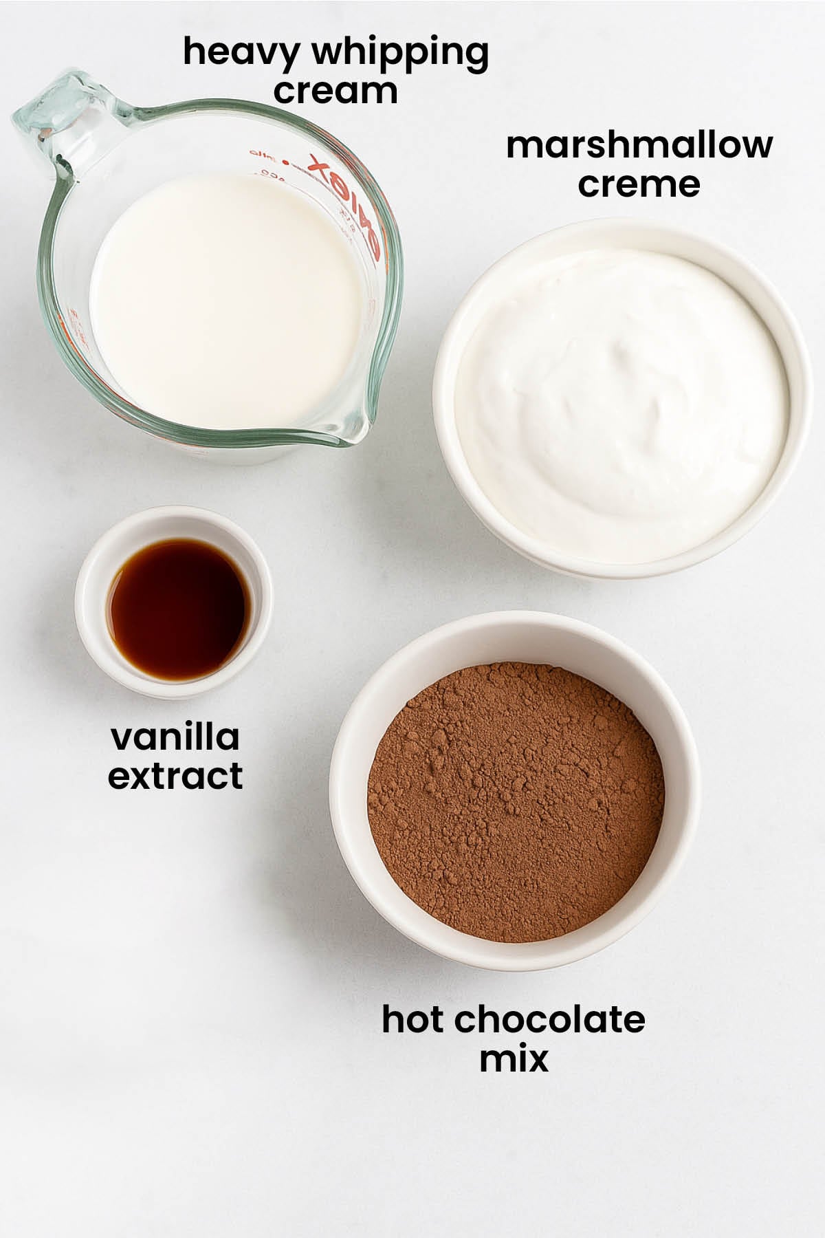 individual ingredients for hot chocolate dip laid out against a white background.