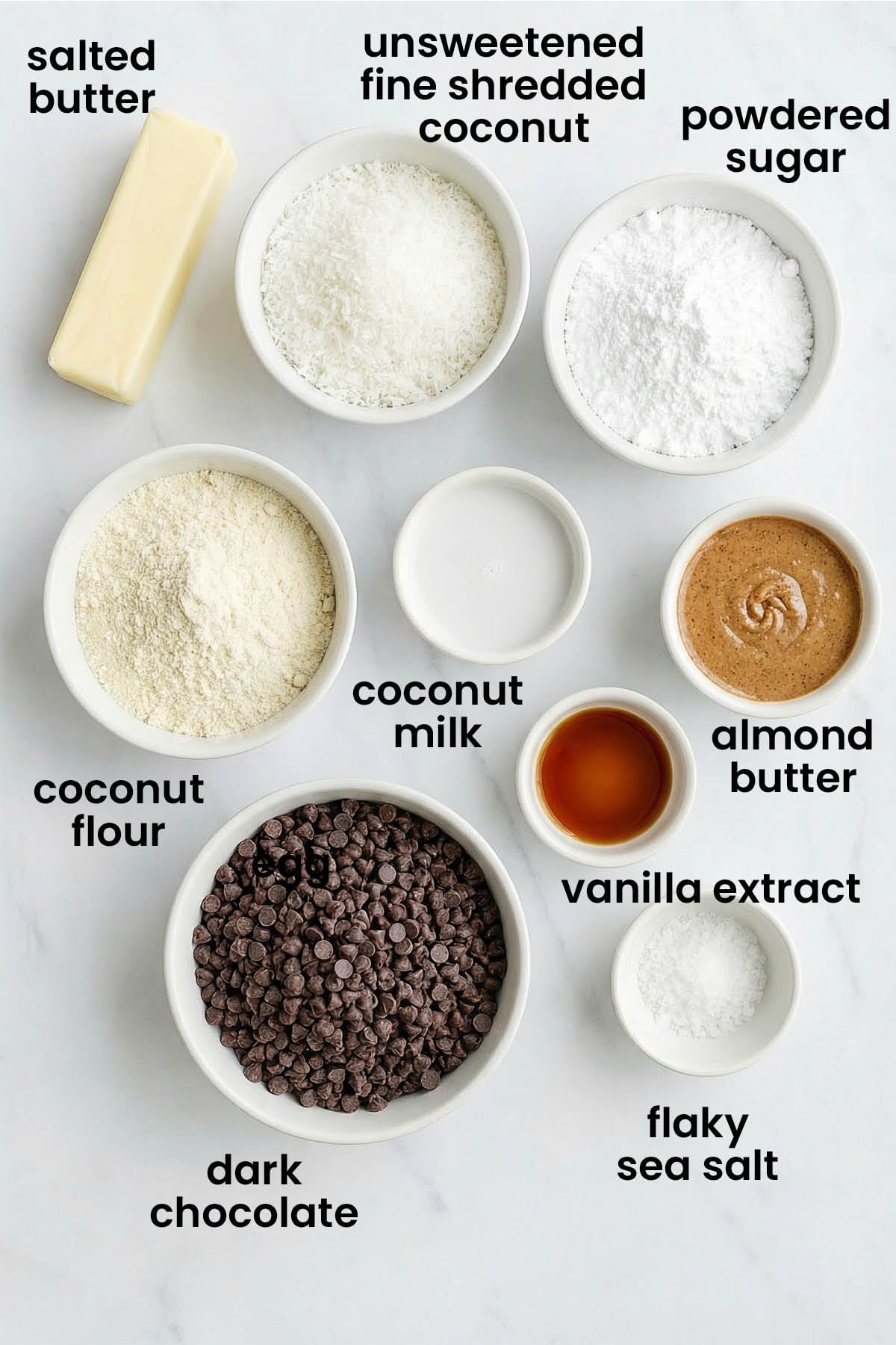 individual ingredients for dark chocolate coconut almond butter eggs laid out against a white background.